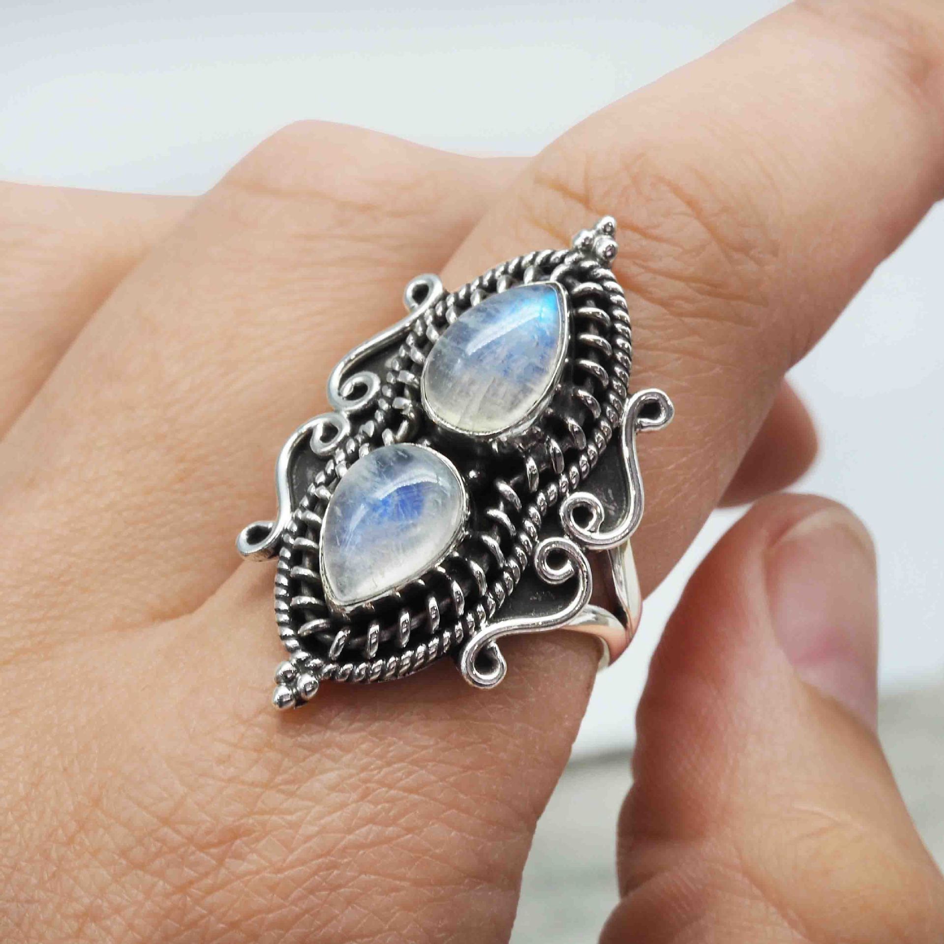 Pear-shaped moonstone ring with water drops